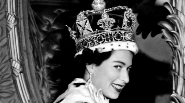 Embargoed to 2200 Saturday December 3, 2022 GMT File photo dated 2/6/1953 of Queen Elizabeth II wearing the Imperial State Crown as she smiles to the crowd from her carriage as she left Westminster Abbey, London after her coronation. The iconic St Edward's Crown has been removed from the Tower of London to be resized for the King ahead of the Coronation. Issue date: Saturday December 3, 2022.