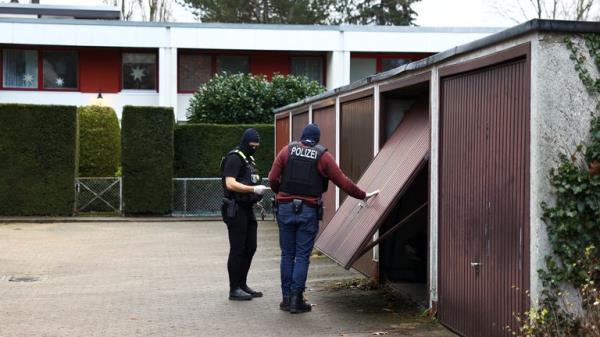 Police secures the area after 25 suspected members and supporters of a far-right group were detained during raids across Germany, in Berlin