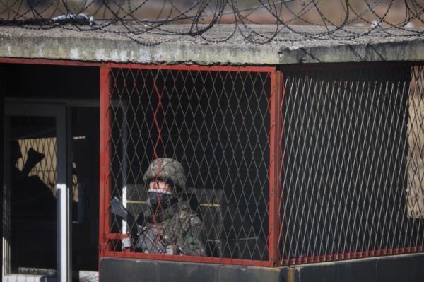 A South Korean soldier stands guard at a guard post near the demilitarized zone separating the two Koreas, in Paju, South Korea