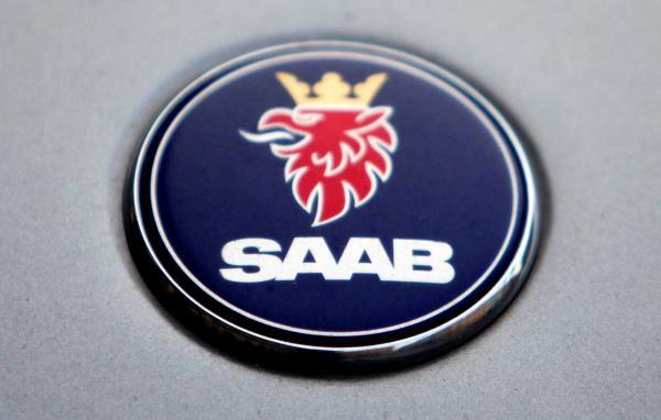 The logo of Swedish manufacturer Saab is seen on a car in Prague