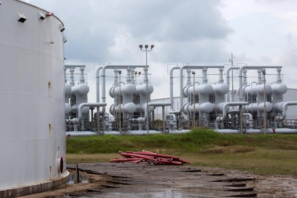 An oil storage tank and crude oil pipeline equipment is seen during a tour by the Department of Energy at the Strategic Petroleum Reserve in Freeport