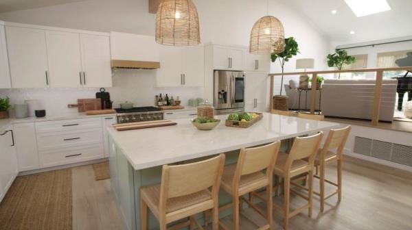 A sage green island in a new kitchen