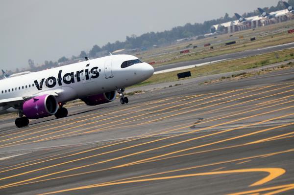 A Volaris airplane is pictured on the airstrip at Benito Juarez international airport in Mexico City