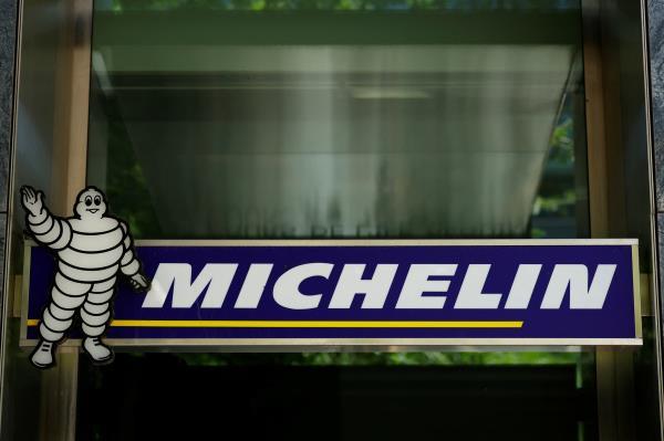 The logo of French tyre maker Michelin is seen at a company building near Paris