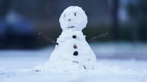 A snowman during wintry conditions after overnight snow showers in Warwick. Parts of the UK are being hit by freezing conditions with the UK Health Security Agency (UKHSA) issuing a Level 3 cold weather alert covering England until Monday and the Met Office issuing several yellow weather warnings for snow and ice in parts of the UK over the coming days. Picture date: Sunday December 11, 2022.