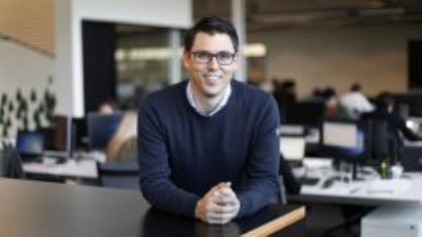 In this Wednesday, Nov. 14, 2018, photo R.J. Scaringe, Chief Executive Officer of Rivian poses for a photo in Plymouth, Mich. 