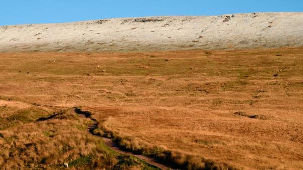 A light dusting of snow covers the tops of the Brecon Beacons. 7 December. Pic: AP