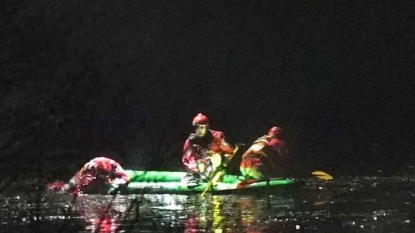 Emergency personnel search the lake 