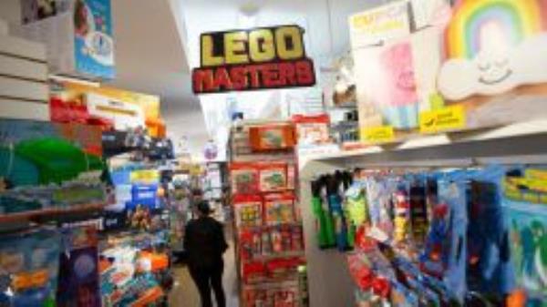 An employee walks through the aisles of Mary Arnold Toys, New York city oldest toy store on August 2, 2021. - It's always "better to shop a little early" for the holidays, but this year, Judy Ishayik, co-owner of a New York toy store says, "We are telling people to shop for Christmas in September."
Global shipping snags are causing shortages, delivery delays and price increases -- all headaches for toy stores and manufacturers. (Photo by Kena Betancur / AFP) (Photo by KENA BETANCUR/AFP via Getty Images)