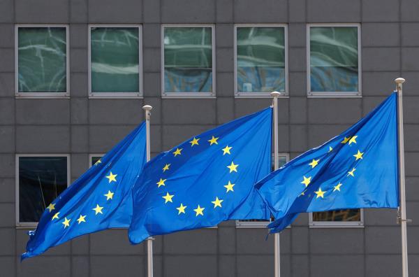 European Union flags flutter outside the EU Commission headquarters in Brussels
