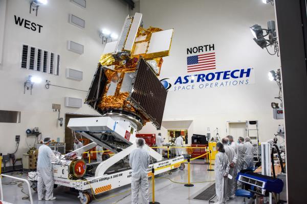 The Surface Water and Ocean Topography (SWOT) radar satellite spacecraft is moved into a transport container inside the Astrotech facility at Vandenberg Space Force base