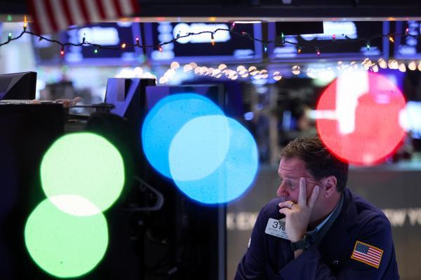A trader works on the trading floor at the New York Stock Exchange (NYSE) in New York City