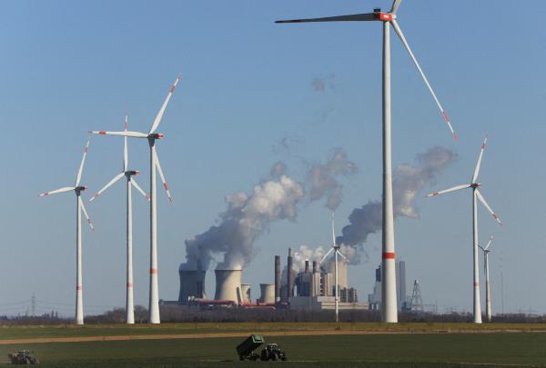 Windmill power plants and brown coal fired power plants of RWE, one of Europe's biggest utilities in Neurath near Cologne