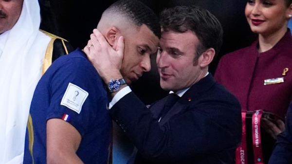 France's President Emmanuel Macron commiserates France's Kylian Mbappe. Pic: AP