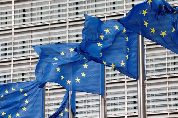 European Union flags flutter outside the EU Commission headquarters in Brussels