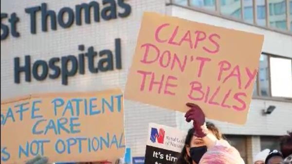 Ashish Joshi talks to striking nurses outside St Thomas' hospital in London