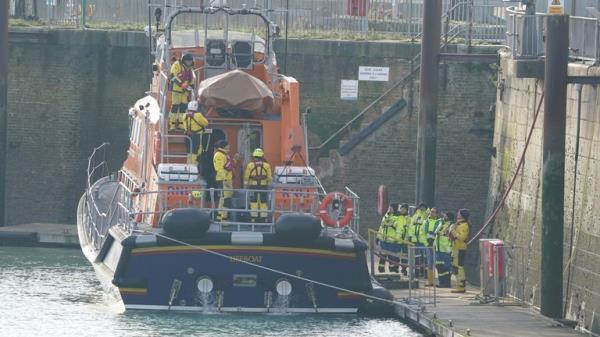 The Dover lifeboat returns to the Port of Dover after a large search and rescue operation launched in the Channel off the coast of Dungeness, in Kent, following an incident involving a small boat likely to have been carrying migrants. Three people have died following the incident and 43 people have been rescued, a Government source said. Picture date: Wednesday December 14, 2022.
