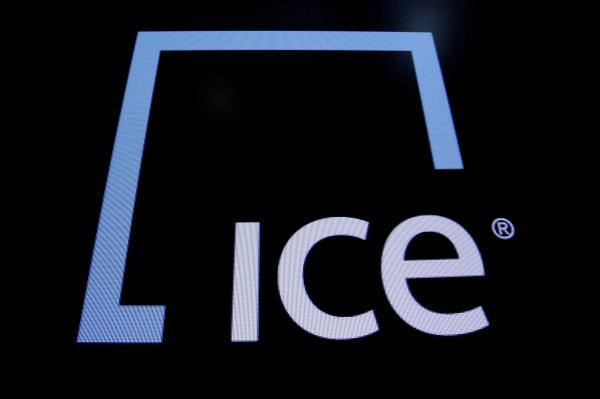 A screen displays the ticker symbol and logo for Intercontinental Exchange Inc. (ICE) on the floor of the New York Stock Exchange