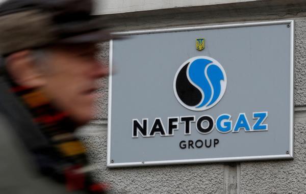 A man walks past Naftogaz headquarters in Kyiv