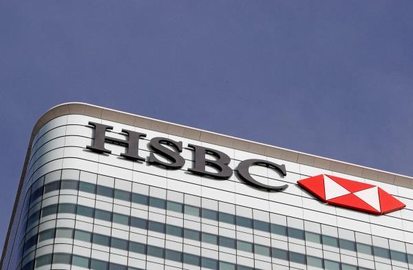 The HSBC bank logo is seen at their offices in the Canary Wharf financial district in London