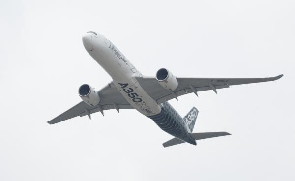 A Airbus A350 aircraft during a display at the Farnborough International Airshow, in Farnborough