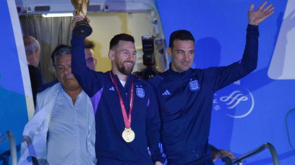 Argentina's Lionel Messi holds the FIFA World Cup trophy. Pic: AP 
